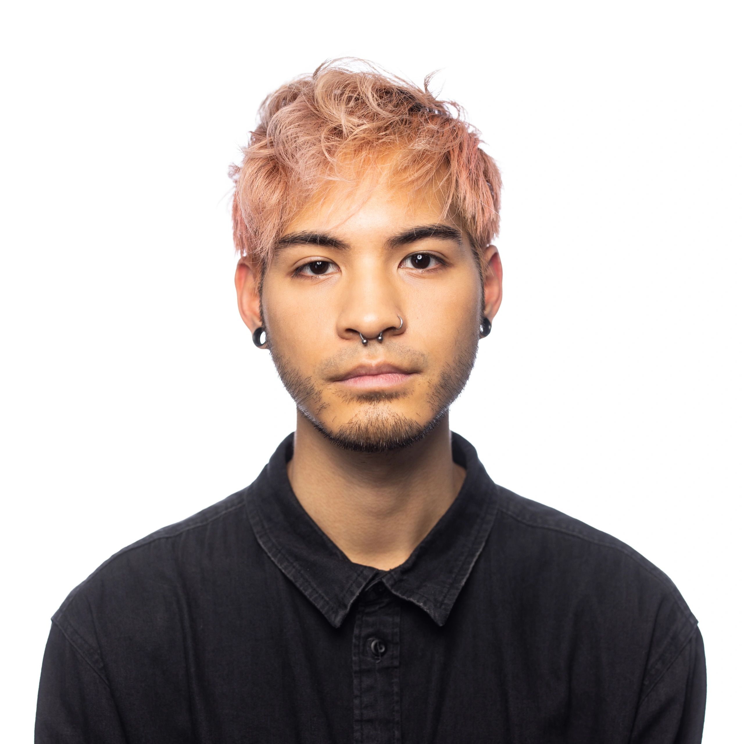 Professional headshot of a serious man on a white background